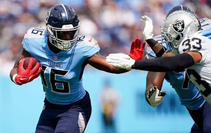 Tennessee Titans wide receiver Treylon Burks (16) runs the ball past Las Vegas Raiders safety Roderic Teamer (33) during the first quarter at Nissan Stadium Sunday, Sept. 25, 2022, in Nashville, Tenn.
